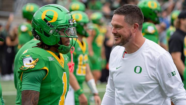 Oregon head coach Dan Lanning, right, talks with Oregon wide receiver Dakorien Moore during warmups as the Oregon Ducks host the Oklahoma State Cowboys on Sept. 6, 2025, at Autzen Stadium in Eugene, Oregon. Oregon head coach Dan Lanning, right, talks with Oregon wide receiver Dakorien Moore during warmups as the Oregon Ducks host the Oklahoma State Cowboys on Sept. 6, 2025, at Autzen Stadium in Eugene, Oregon.
