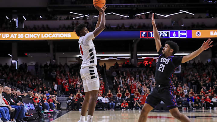 Feb 22, 2025; Cincinnati, Ohio, USA; Cincinnati Bearcats forward Tyler Betsey (14) shoots against TCU Horned Frogs guard Noah Reynolds (21) in the first half at Fifth Third Arena. Mandatory Credit: Katie Stratman-Imagn Images Feb 22, 2025; Cincinnati, Ohio, USA; Cincinnati Bearcats forward Tyler Betsey (14) shoots against TCU Horned Frogs guard Noah Reynolds (21) in the first half at Fifth Third Arena. Mandatory Credit: Katie Stratman-Imagn Images