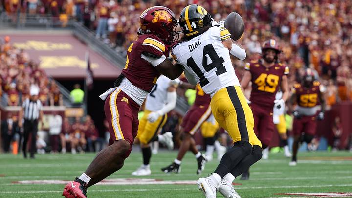 Oct 24, 2026; Minneapolis, Minnesota, USA; Minnesota Golden Gophers defensive back Aydan West (5) breaks up a pass intended for Iowa Hawkeyes wide receiver Tony Diaz (14) during the first half at Huntington Bank Stadium. Mandatory Credit: Matt Krohn-Imagn Images