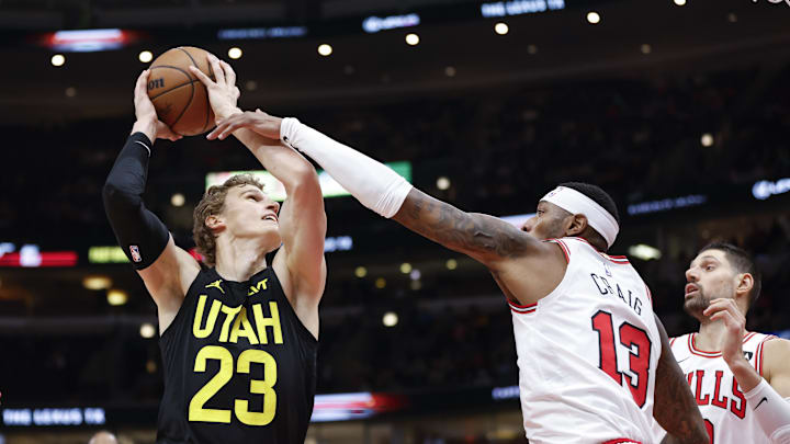 Nov 6, 2023; Chicago, Illinois, USA; Utah Jazz forward Lauri Markkanen (23) drives to the basket against Chicago Bulls forward Torrey Craig (13) during the first half at United Center. Mandatory Credit: Kamil Krzaczynski-Imagn Images