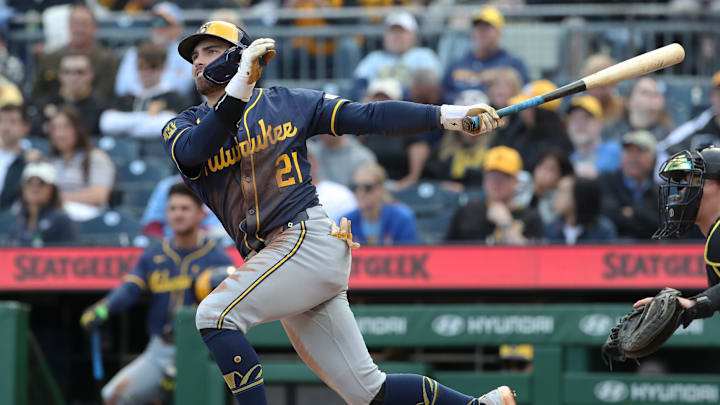 May 24, 2025; Pittsburgh, Pennsylvania, USA;  Milwaukee Brewers third baseman Caleb Durbin (21) hits a single against the Pittsburgh Pirates during the seventh inning at PNC Park. Mandatory Credit: Charles LeClaire-Imagn Images