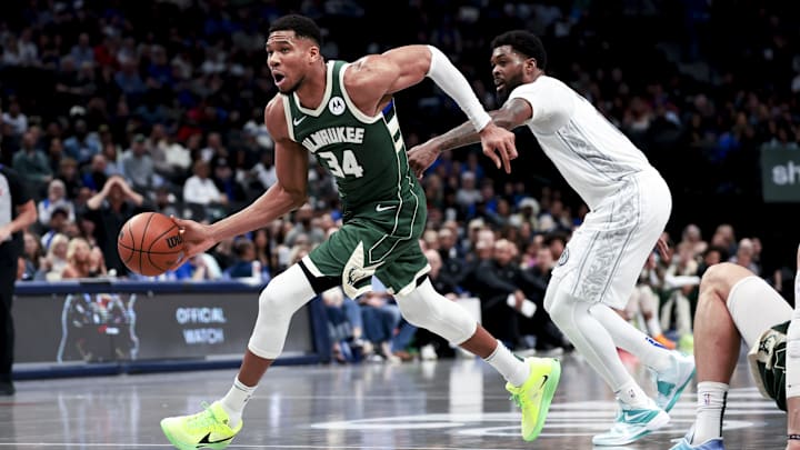 Mar 1, 2025; Dallas, Texas, USA;  Milwaukee Bucks forward Giannis Antetokounmpo (34) drives to the basket past Dallas Mavericks forward Naji Marshall (13) during the second half at American Airlines Center. Mandatory Credit: Kevin Jairaj-Imagn Images
