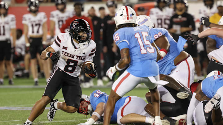 Oct 4, 2025; Houston, Texas, USA; Texas Tech Red Raiders running back Cameron Dickey (8) rushes against Houston Cougars defensive back Will James (15) in the second half at TDECU Stadium. Mandatory Credit: Thomas Shea-Imagn Images Oct 4, 2025; Houston, Texas, USA; Texas Tech Red Raiders running back Cameron Dickey (8) rushes against Houston Cougars defensive back Will James (15) in the second half at TDECU Stadium. Mandatory Credit: Thomas Shea-Imagn Images
