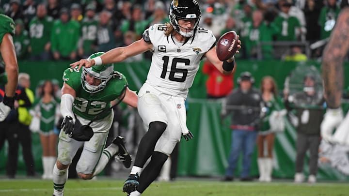 Nov 3, 2024; Philadelphia, Pennsylvania, USA; Jacksonville Jaguars quarterback Trevor Lawrence (16) scores a touchdown past Philadelphia Eagles safety Reed Blankenship (32) during the fourth quarter at Lincoln Financial Field. Mandatory Credit: Eric Hartline-Imagn Images Nov 3, 2024; Philadelphia, Pennsylvania, USA; Jacksonville Jaguars quarterback Trevor Lawrence (16) scores a touchdown past Philadelphia Eagles safety Reed Blankenship (32) during the fourth quarter at Lincoln Financial Field. Mandatory Credit: Eric Hartline-Imagn Images