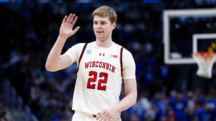 Mar 22, 2025; Denver, CO, USA; Wisconsin Badgers forward Steven Crowl (22) reacts against the Brigham Young Cougars during the second half in the second round of the NCAA Tournament at Ball Arena. 
