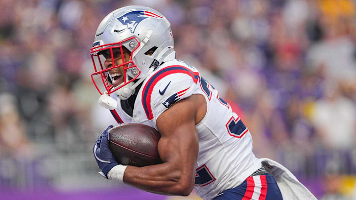 New England Patriots running back TreVeyon Henderson (32) celebrates his touchdown against the Minnesota Vikings in the first quarter at U.S. Bank Stadium. 