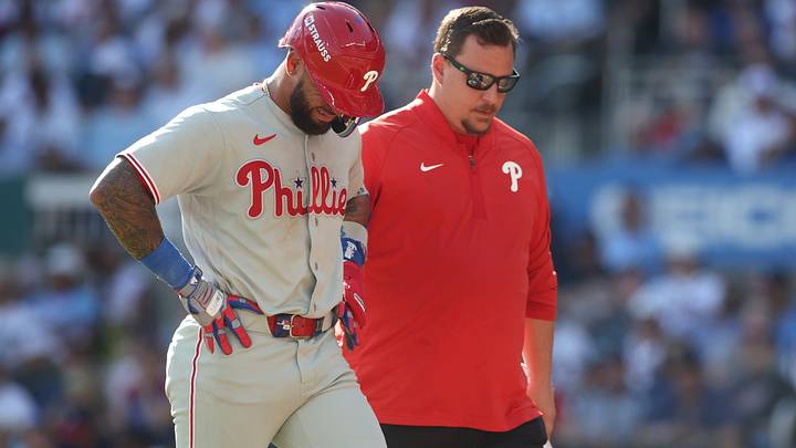 Sep 30, 2026; Cumberland, Georgia, USA; Philadelphia Phillies third baseman Edmundo Sosa (33) is checked on by a trainer after a single against the Atlanta Braves in the ninth inning during game two of the Wildcard round for the 2026 MLB Playoffs at Truist Park. Mandatory Credit: Brett Davis-Imagn Images Sep 30, 2026; Cumberland, Georgia, USA; Philadelphia Phillies third baseman Edmundo Sosa (33) is checked on by a trainer after a single against the Atlanta Braves in the ninth inning during game two of the Wildcard round for the 2026 MLB Playoffs at Truist Park. Mandatory Credit: Brett Davis-Imagn Images