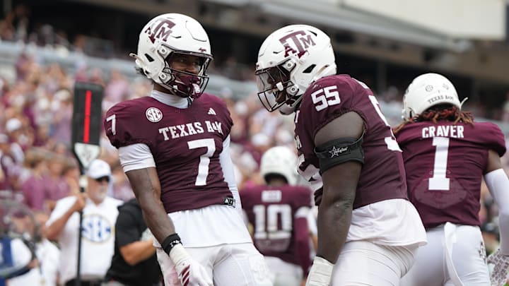 Sep 6, 2025; College Station, Texas, USA; Texas A&M Aggies wide receiver KC Concepcion (7) and Texas A&M Aggies offensive lineman Ar'maj Reed-Adams (55) celebrate after a touchdown during the second quarter against the Utah State Aggies at Kyle Field. Mandatory Credit: Sean Thomas-Imagn Images