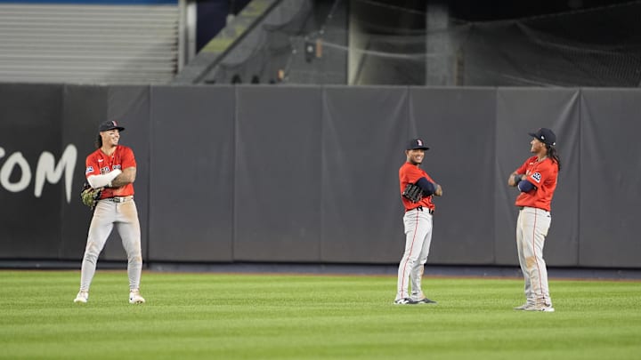 Aug 22, 2025; Bronx, New York, USA; Boston Red Sox outfielders Jarren Duran (16), Ceddanne Rafaela (3) and Jhostynxon Garcia (51) celebrate the victory after the ninth inning against the New York Yankees at Yankee Stadium. Mandatory Credit: Gregory Fisher-Imagn Images