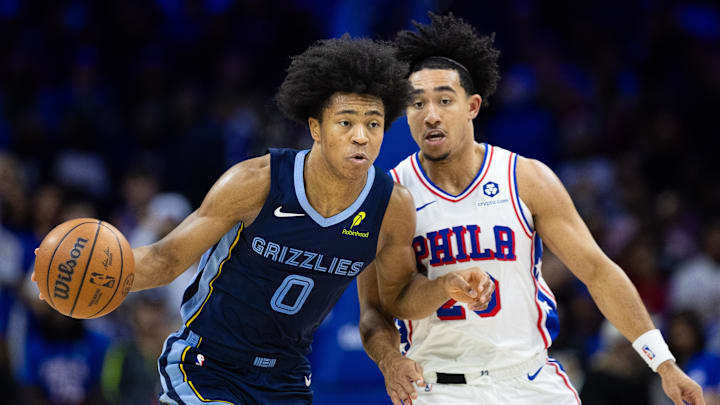Nov 2, 2024; Philadelphia, Pennsylvania, USA; Memphis Grizzlies forward Jaylen Wells (0) dribbles the ball in front of Philadelphia 76ers guard Jared McCain (20) during the fourth quarter at Wells Fargo Center. Mandatory Credit: Bill Streicher-Imagn Images