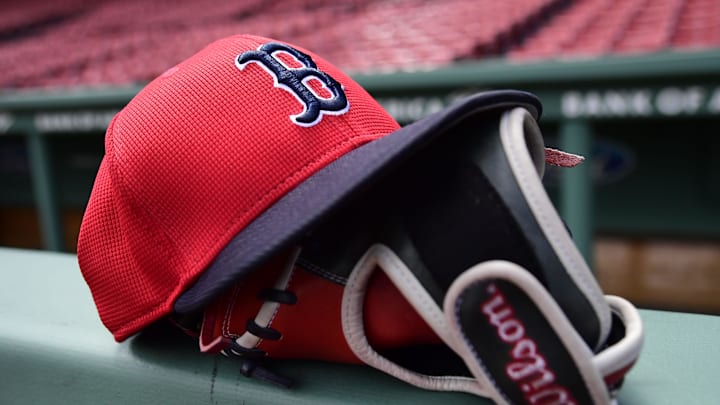 May 18, 2025; Boston, Massachusetts, USA; A Boston Red Sox hat and glove rests on the railing by the dugout prior to a game against the Atlanta Braves at Fenway Park. Mandatory Credit: Bob DeChiara-Imagn Images May 18, 2025; Boston, Massachusetts, USA; A Boston Red Sox hat and glove rests on the railing by the dugout prior to a game against the Atlanta Braves at Fenway Park. Mandatory Credit: Bob DeChiara-Imagn Images