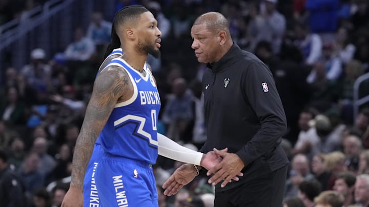 Nov 23, 2024; Milwaukee, Wisconsin, USA; Milwaukee Bucks head coach Doc Rivers congratulates Milwaukee Bucks guard Damian Lillard (0) in the second half at Fiserv Forum. Mandatory Credit: Michael McLoone-Imagn Images
