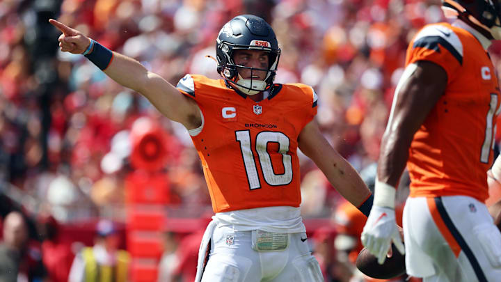 Sep 22, 2024; Tampa, Florida, USA; Denver Broncos quarterback Bo Nix (10) reacts after he gets first down against the Tampa Bay Buccaneers during the second half at Raymond James Stadium. 