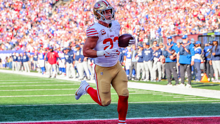 Nov 2, 2025; East Rutherford, New Jersey, USA; San Francisco 49ers running back Christian McCaffrey (23) runs after the catch for a touchdown against the New York Giants during the first half at MetLife Stadium. Nov 2, 2025; East Rutherford, New Jersey, USA; San Francisco 49ers running back Christian McCaffrey (23) runs after the catch for a touchdown against the New York Giants during the first half at MetLife Stadium.