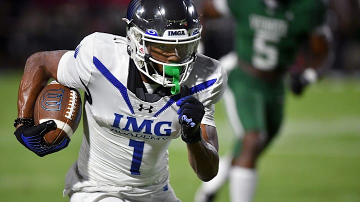 IMG Academy wide receiver Donovan Olugbode (#1) looks to gain extra yardage against the Venice defense. The Venice High School Indians hosted the IMG Academy Ascenders National team on Friday, Oct. 4, 2024. IMG Academy wide receiver Donovan Olugbode (#1) looks to gain extra yardage against the Venice defense. The Venice High School Indians hosted the IMG Academy Ascenders National team on Friday, Oct. 4, 2024.