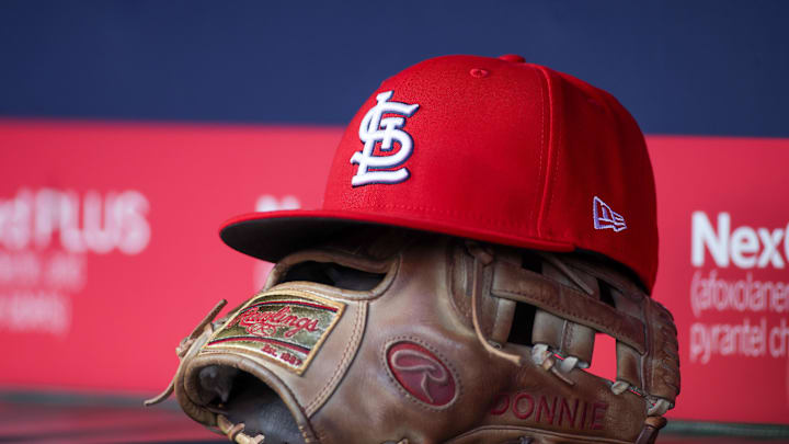 Apr 21, 2025; Atlanta, Georgia, USA; A St. Louis Cardinals hat and glove in the dugout against the Atlanta Braves in the first inning at Truist Park. Mandatory Credit: Brett Davis-Imagn Images Apr 21, 2025; Atlanta, Georgia, USA; A St. Louis Cardinals hat and glove in the dugout against the Atlanta Braves in the first inning at Truist Park. Mandatory Credit: Brett Davis-Imagn Images