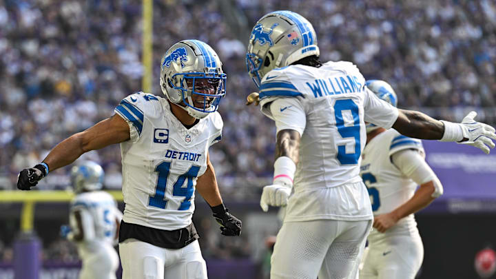 Oct 20, 2024; Minneapolis, Minnesota, USA; Detroit Lions wide receiver Amon-Ra St. Brown (14) reacts with wide receiver Jameson Williams (9) after catching a 35 yard touchdown pass from quarterback Jared Goff (not pictured) against the Minnesota Vikings the second quarter at U.S. Bank Stadium. Oct 20, 2024; Minneapolis, Minnesota, USA; Detroit Lions wide receiver Amon-Ra St. Brown (14) reacts with wide receiver Jameson Williams (9) after catching a 35 yard touchdown pass from quarterback Jared Goff (not pictured) against the Minnesota Vikings the second quarter at U.S. Bank Stadium.
