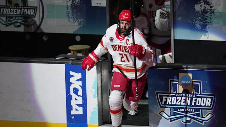 Apr 11, 2026; Las Vegas, Nevada, United States; Denver Pioneers defenseman Kent Anderson (21) takes the ice prior to a game against the Wisconsin Badgers in the championship game of the NCAA men's ice hockey Frozen Four at T-Mobile Arena. Mandatory Credit: Lucas Peltier-Imagn Images