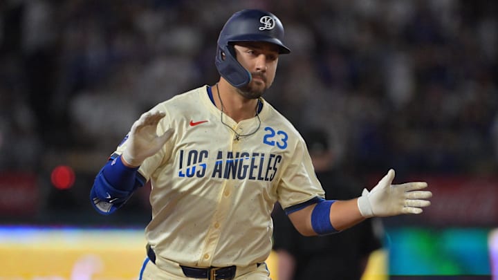 Sep 20, 2025; Los Angeles, California, USA; Los Angeles Dodgers outfielder Michael Conforto (23) reacts after scoring a run during the third inning against the San Francisco Giants at Dodger Stadium. Mandatory Credit: Jayne Kamin-Oncea-Imagn Images