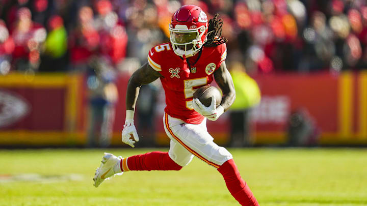 Dec 21, 2024; Kansas City, Missouri, USA; Kansas City Chiefs wide receiver Hollywood Brown (5) runs with the ball during the first half against the Houston Texans at GEHA Field at Arrowhead Stadium. Mandatory Credit: Jay Biggerstaff-Imagn Images