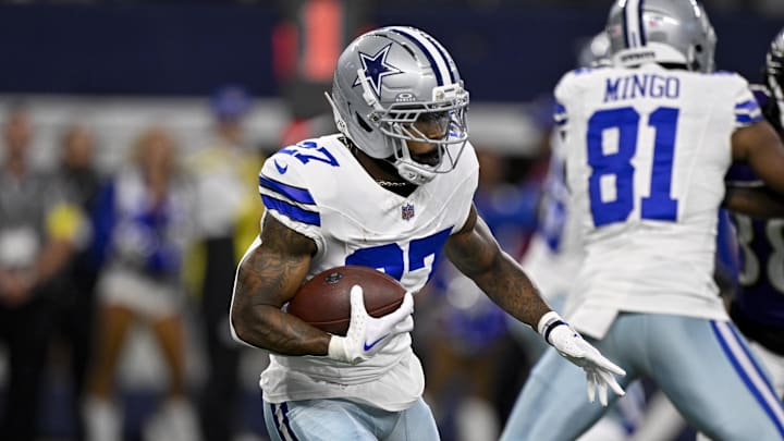 Dallas Cowboys running back Miles Sanders runs with the ball during a game against the Baltimore Ravens at AT&T Stadium