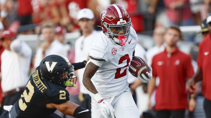 Oct 5, 2024; Nashville, Tennessee, USA;  Alabama Crimson Tide wide receiver Ryan Williams (2) catches a pass and carries it in for a touchdown against Vanderbilt Commodores linebacker Randon Fontenette (2) during the second half at FirstBank Stadium. 