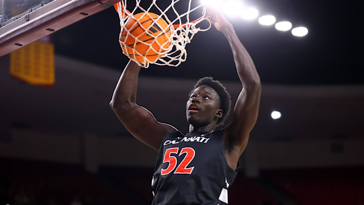 Jan 24, 2026; Tempe, Arizona, USA; Cincinnati Bearcats center Moustapha Thiam (52) dunks the ball against the Arizona State Sun Devils in the first half at Desert Financial Arena. Mandatory Credit: Mark J. Rebilas-Imagn Images