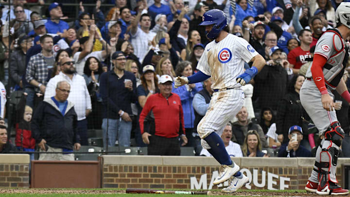 Sep 28, 2024; Chicago, Illinois, USA;    Chicago Cubs shortstop Dansby Swanson (7) scores during the eighth inning against the Cincinnati Reds at Wrigley Field.