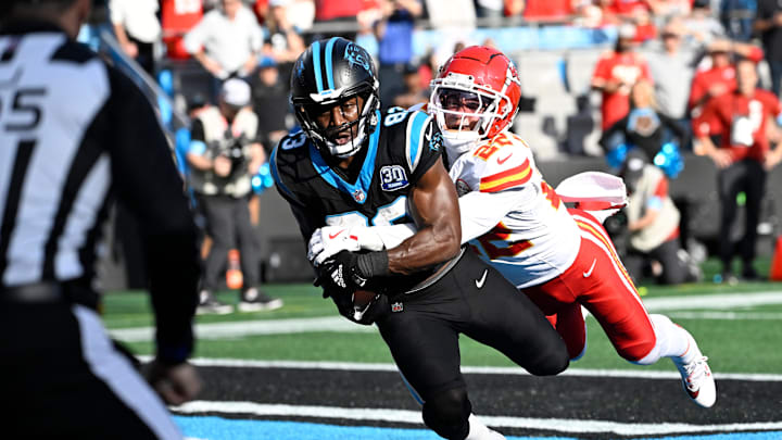 Nov 24, 2024; Charlotte, North Carolina, USA;  Carolina Panthers wide receiver David Moore (83) catches a touchdown as Kansas City Chiefs cornerback Trent McDuffie (22) defends in the third quarter at Bank of America Stadium. Mandatory Credit: Bob Donnan-Imagn Images