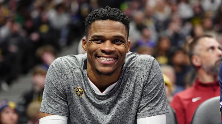 Dec 28, 2024; Denver, Colorado, USA; Denver Nuggets guard Russell Westbrook (4) reacts from the bench in the second half against the Detroit Pistons at Ball Arena. Mandatory Credit: Ron Chenoy-Imagn Images