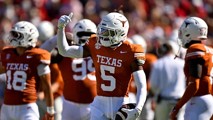 Texas Longhorns defensive back Malik Muhammad celebrates after he intercepts a pass thrown by Oklahoma Sooners quarterback John Mateer during the first half at the Cotton Bowl. 