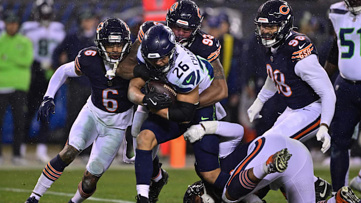 Running back Zach Charbonnet of Seattle carries against the Bears defense in 2024.