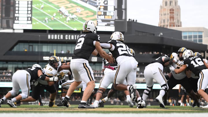 Oct 25, 2025; Nashville, Tennessee, USA; Vanderbilt Commodores quarterback Diego Pavia (2) hands off to running back Sedrick Alexander (28) in the end zone during the third quarter against the Missouri Tigers at FirstBank Stadium. Mandatory Credit: Steve Roberts-Imagn Images Oct 25, 2025; Nashville, Tennessee, USA; Vanderbilt Commodores quarterback Diego Pavia (2) hands off to running back Sedrick Alexander (28) in the end zone during the third quarter against the Missouri Tigers at FirstBank Stadium. Mandatory Credit: Steve Roberts-Imagn Images