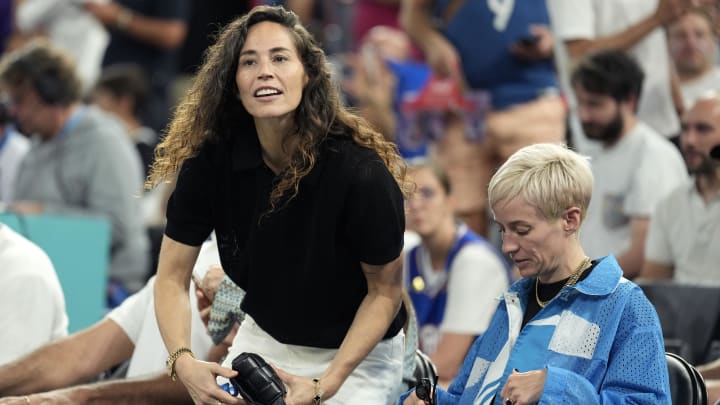Aug 8, 2024; Paris, France; Sue Bird and Megan Rapinoe look on before the game between France and Germany in a men's basketball semifinal game during the Paris 2024 Olympic Summer Games at Accor Arena. 