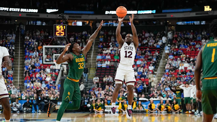 Mar 21, 2025; Raleigh, NC, USA; Mississippi State Bulldogs guard Josh Hubbard (12) shoots the ball against Baylor Bears guard Jalen Celestine (32) during the second half in the first round of the NCAA Tournament at Lenovo Center. Mandatory Credit: Bob Donnan-Imagn Images