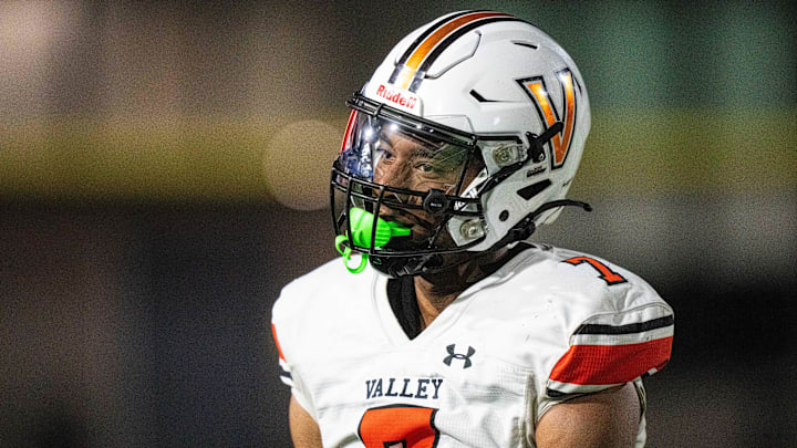 Valley's Jayden McGregory (7) looks to the Southeast Polk sideline after a stop on thrid down on Friday, Aug. 30, 2024, at Southeast Polk Stadium.