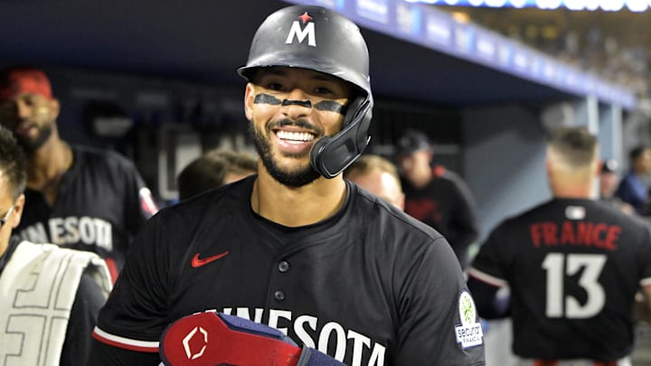 Jul 22, 2025; Los Angeles, California, USA; Minnesota Twins shortstop Carlos Correa (4) in the dugout after scoring a run against the Los Angeles Dodgers at Dodger Stadium. 