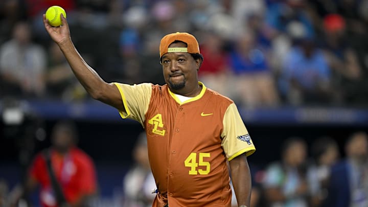 Jul 13, 2024; Arlington, TX, USA;  MLB Hall of Fame pitcher Pedro Martinez (45) of the American League warms up before he pitches against the National League during the 2024 All Star Celebrity Softball Game at Globe Life Field. Mandatory Credit: Jerome Miron-Imagn Images