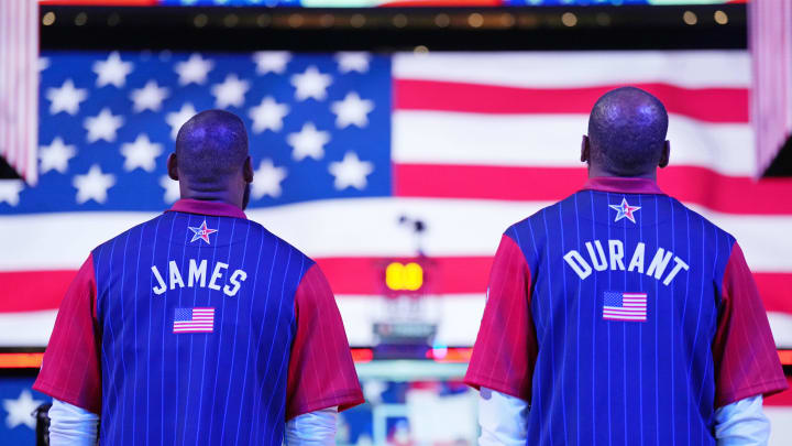 Feb 18, 2024; Indianapolis, Indiana, USA; Western Conference forward LeBron James (23) of the Los Angeles Lakers and forward Kevin Durant (35) of the Phoenix Suns look on during the national anthem before the 73rd NBA All Star game at Gainbridge Fieldhouse. Mandatory Credit: Kyle Terada-USA TODAY Sports