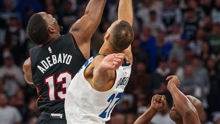 Oct 28, 2023; Minneapolis, Minnesota, USA; Miami Heat center Bam Adebayo (13) wins the opening tip