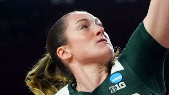 Oklahoma's Raegan Beers (15) goes up for a basket as Michigan State's Grace Vanslooten (14) defends during a second-round game in the NCAA women's basketball tournament between the Oklahoma Sooners and Michigan State Spartans at Lloyd Noble Center in Norman, Okla., Sunday March 22, 2026. Oklahoma's Raegan Beers (15) goes up for a basket as Michigan State's Grace Vanslooten (14) defends during a second-round game in the NCAA women's basketball tournament between the Oklahoma Sooners and Michigan State Spartans at Lloyd Noble Center in Norman, Okla., Sunday March 22, 2026.