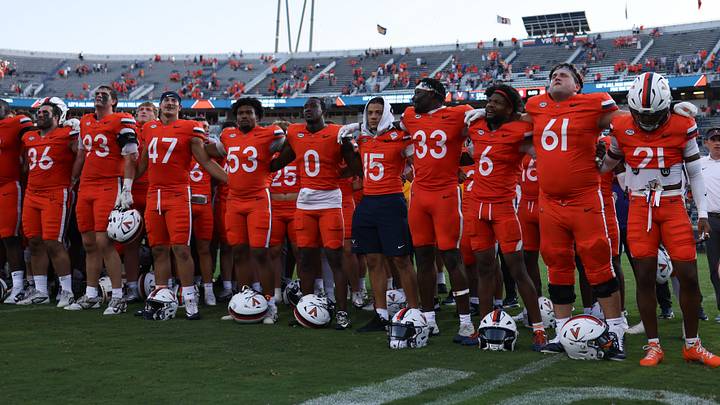 Aug 29, 2026; Charlottesville, Virginia, USA;  Virginia Cavaliers celebrate with fans following the game against the North Carolina State Wolfpack at Scott Stadium.  Mandatory Credit: Greg Atkins-Imagn Images