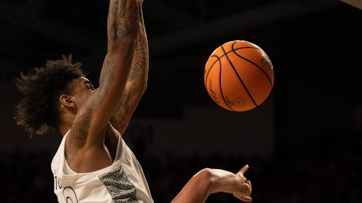 Cincinnati Bearcats forward Dillon Mitchell (23) dunks over Arizona State Sun Devils forward Basheer Jihad (8) in the second half of the NCAA basketball game at Fifth Third Arena in Cincinnati on Saturday, January 18, 2025.