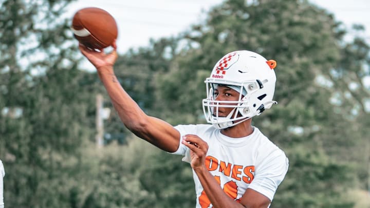 Jones quarterback Dereon Coleman, who will play his college football at the University of Miami, tosses a pass during practice. His team is preparing to head to the FHSAA Class 4A state playoffs with a 10-0 record.