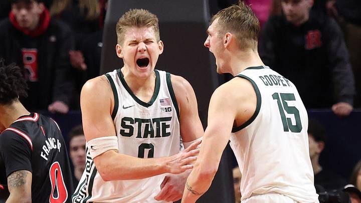 Jan 27, 2026; Piscataway, New Jersey, USA; Michigan State Spartans forward Jaxon Kohler (0) reacts with center Carson Cooper (15) after scoring a basket during overtime against the Rutgers Scarlet Knights at Jersey Mike's Arena. Mandatory Credit: Vincent Carchietta-Imagn Images Jan 27, 2026; Piscataway, New Jersey, USA; Michigan State Spartans forward Jaxon Kohler (0) reacts with center Carson Cooper (15) after scoring a basket during overtime against the Rutgers Scarlet Knights at Jersey Mike's Arena. Mandatory Credit: Vincent Carchietta-Imagn Images