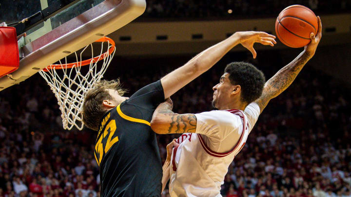 Indiana's Kel'el Ware (1) dunks over Iowa's Owen Freeman (32) as he is fouled at Simon Skjodt Assembly Hall on Tuesday, Jan. 30, 2024. Indiana's Kel'el Ware (1) dunks over Iowa's Owen Freeman (32) as he is fouled at Simon Skjodt Assembly Hall on Tuesday, Jan. 30, 2024.