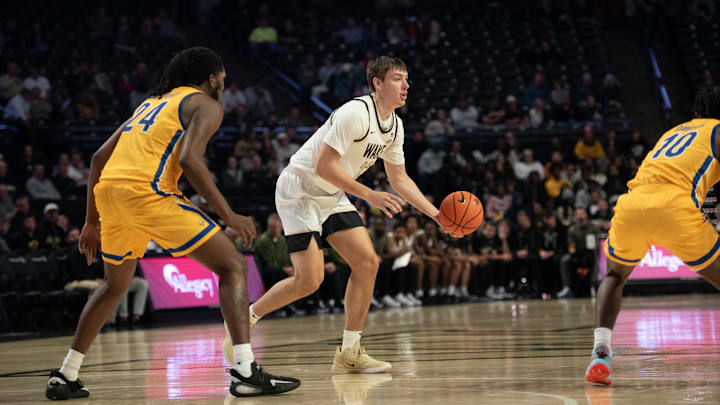 Cooper Schwieger looks to hand off the ball for Wake Forest