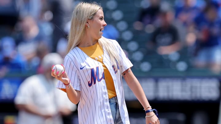 Viral internet star Haliey Welch throws out a ceremonial first pitch before a game between the New York Mets and the Oakland Athletics at Citi Field. Viral internet star Haliey Welch throws out a ceremonial first pitch before a game between the New York Mets and the Oakland Athletics at Citi Field.