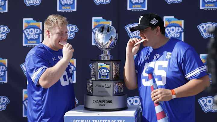 BYU offensive linemen Bruce Mitchell and Austin Leausa