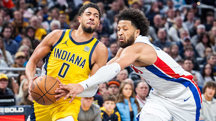 Nov 29, 2024; Indianapolis, Indiana, USA; Indiana Pacers guard Tyrese Haliburton (0) shoots the ball while Detroit Pistons guard Cade Cunningham (2) defends: Trevor Ruszkowski-Imagn Images